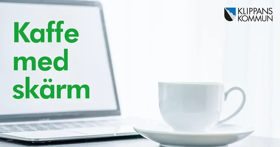 Kaffekopp och dator med grön text Kaffe med skärm.